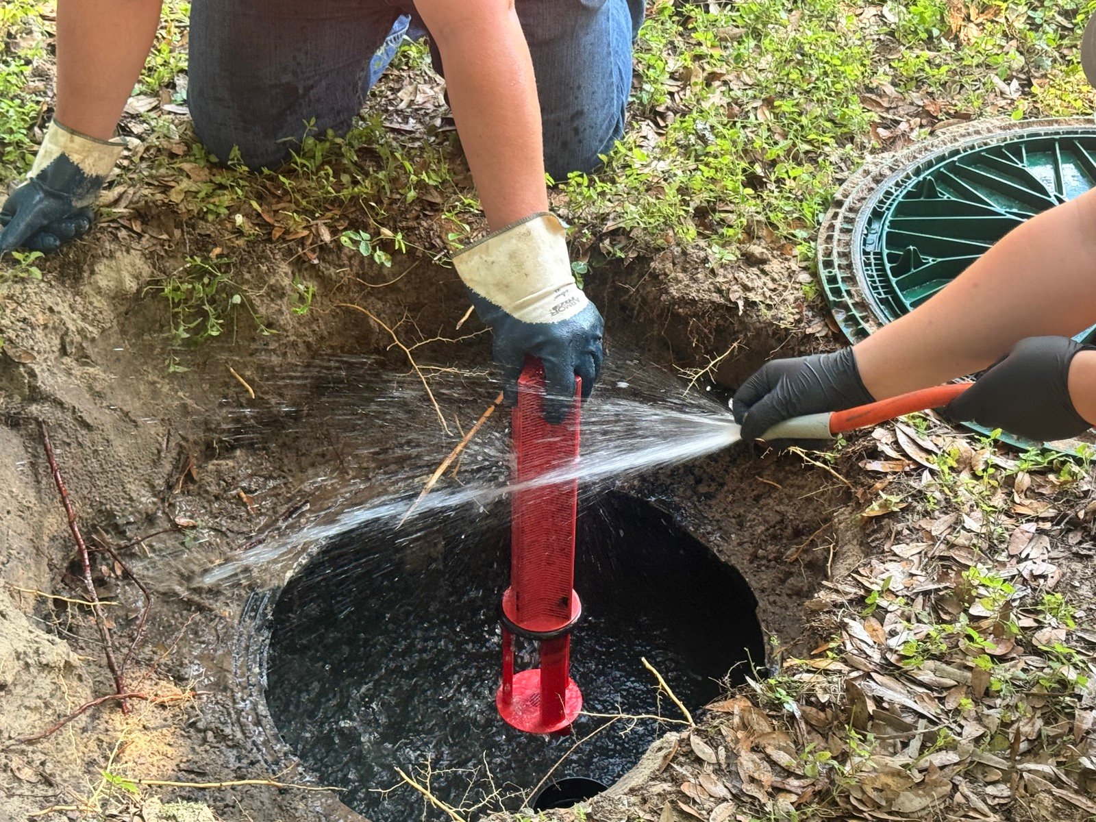Rapid Response crew servicing a septic tank